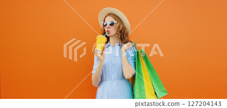 Fashion, shopping and clothing, beautiful relaxed young woman with colorful shopping bags Fashion, shopping and clothing, beautiful relaxed young woman with colorful shopping bags 127204143