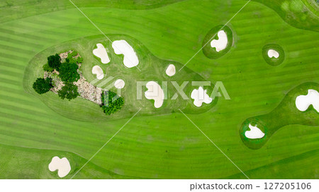 Aerial top view golf course with lush greens, green fairway and sand bunker, Golf course green grass and trees fairway and putting green, Beautiful golf course. 127205106