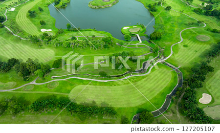 Aerial top view golf course with lush greens, green fairway and sand bunker, Golf course green grass and trees fairway and putting green, Beautiful golf course. 127205107