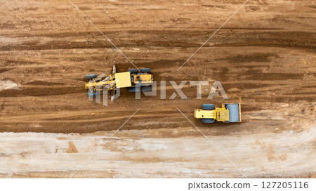 Aerial view motor grader civil at construction site, Motor grader work on construction site, Road grader on road construction site machine work on the construction of new road. Aerial view motor grader civil at construction site, Motor grader work on construction site, Road grader on road construction site machine work on the construction of new road. 127205116