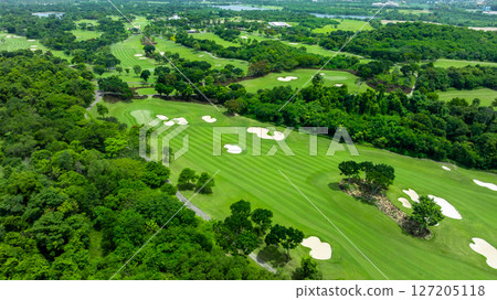 Aerial top view golf course with lush greens, green fairway and sand bunker, Golf course green grass and trees fairway and putting green, Beautiful golf course. Aerial top view golf course with lush greens, green fairway and sand bunker, Golf course green grass and trees fairway and putting green, Beautiful golf course. 127205118