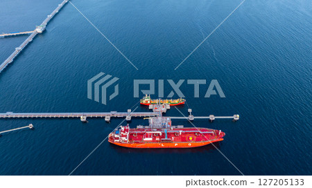Aerial view LPG gas tanker ship at oil and gas terminal platform, Liquefied Petroleum Gas tanker ship industrial offshore oil gas terminal tanker ship LPG tanker ship loading arm loading and unloading 127205133