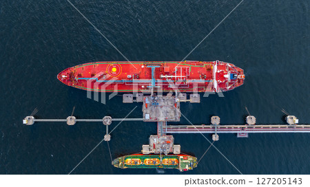 Aerial view LPG gas tanker ship at oil and gas terminal platform, Liquefied Petroleum Gas tanker ship industrial offshore oil gas terminal tanker ship LPG tanker ship loading arm loading and unloading 127205143