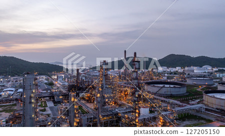 Oil and gas industrial refinery at night, Oil and gas refinery petrochemical plant pipeline steel, Oil and gas refinery factory oil and gas storage tank pipeline steel at night, Global energy refinery 127205150