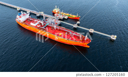 Aerial view LPG gas tanker ship at oil and gas terminal platform, Liquefied Petroleum Gas tanker ship industrial offshore oil gas terminal tanker ship LPG tanker ship loading arm loading and unloading 127205160