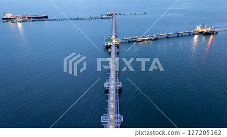 Aerial view LPG gas tanker ship at oil and gas terminal platform, Liquefied Petroleum Gas tanker ship industrial offshore oil gas terminal tanker ship LPG tanker ship loading arm loading and unloading 127205162