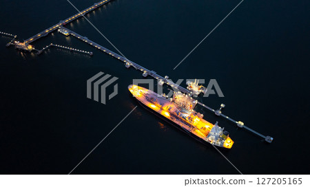 Aerial view LPG gas tanker ship at oil and gas terminal platform, Liquefied Petroleum Gas tanker ship industrial offshore oil gas terminal tanker ship LPG tanker ship loading arm loading and unloading Aerial view LPG gas tanker ship at oil and gas terminal platform, Liquefied Petroleum Gas tanker ship industrial offshore oil gas terminal tanker ship LPG tanker ship loading arm loading and unloading 127205165