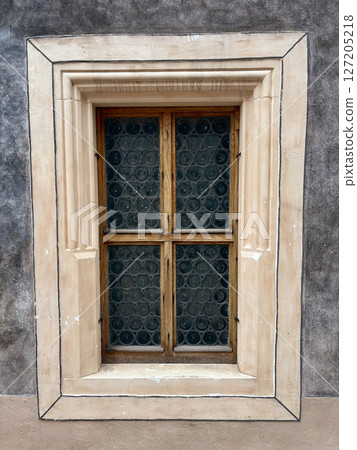 Vintage window with wooden frame and thick glass. Exterior. Vintage window with wooden frame and thick glass. Exterior. 127205218