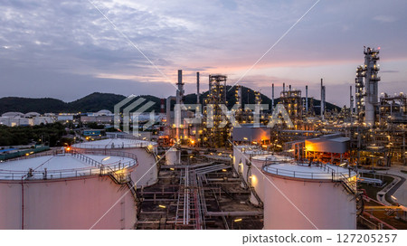 Oil and gas industrial refinery at night, Oil and gas refinery petrochemical plant pipeline steel, Oil and gas refinery factory oil and gas storage tank pipeline steel at night, Global energy refinery Oil and gas industrial refinery at night, Oil and gas refinery petrochemical plant pipeline steel, Oil and gas refinery factory oil and gas storage tank pipeline steel at night, Global energy refinery 127205257