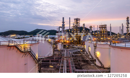 Oil and gas industrial refinery at night, Oil and gas refinery petrochemical plant pipeline steel, Oil and gas refinery factory oil and gas storage tank pipeline steel at night, Global energy refinery 127205258