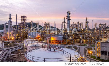 Oil and gas industrial refinery at night, Oil and gas refinery petrochemical plant pipeline steel, Oil and gas refinery factory oil and gas storage tank pipeline steel at night, Global energy refinery 127205259