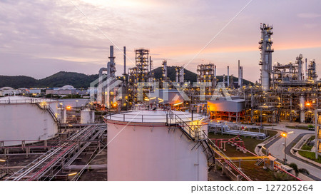Oil and gas industrial refinery at night, Oil and gas refinery petrochemical plant pipeline steel, Oil and gas refinery factory oil and gas storage tank pipeline steel at night, Global energy refinery 127205264