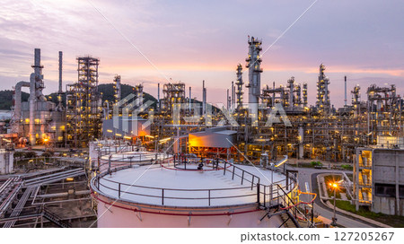Oil and gas industrial refinery, Oil refinery petrochemical plant pipeline steel, Oil refinery factory oil and gas storage tank and pipeline steel at night, Global energy refinery. Oil and gas industrial refinery, Oil refinery petrochemical plant pipeline steel, Oil refinery factory oil and gas storage tank and pipeline steel at night, Global energy refinery. 127205267