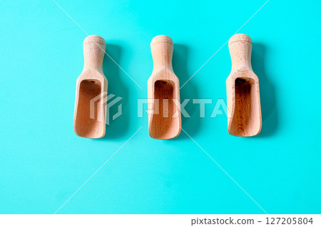 Wooden spoon, chopsticks and equipment on a color background. Top view. Wooden spoon, chopsticks and equipment on a color background. Top view. 127205804