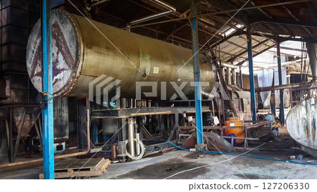 Decommissioned wood ply manufacturing plant, Industrial machineries and tools of Old Factory Facility, Rusty large industrial facilities 127206330