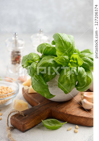 Ingredients for making green pesto sauce. Healthy Italian food. Selective focus, copy space. 127206374
