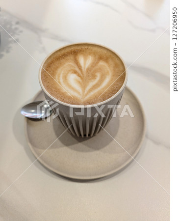 Close Up of an Oat Milk Latte Coffee in White Cup with Love Heart 127206950