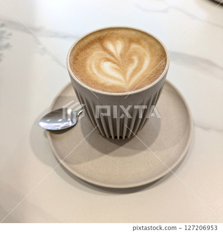 Close Up of an Oat Milk Latte Coffee in White Cup with Love Heart 127206953