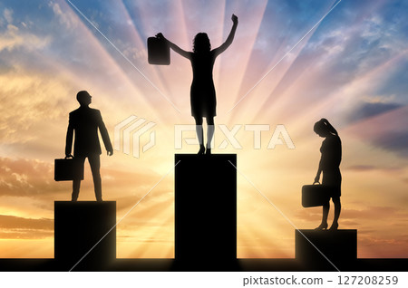Silhouette of a jubilant woman on the podium of a winner and a silhouette of a sad man and woman near 127208259