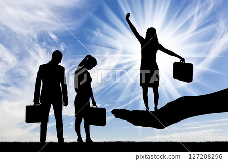 Silhouette of a hand holds a jubilant woman, a frustrated man and woman are standing nearby 127208296