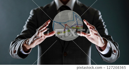 businessman with financial symbols coming from hand, stock markets concept. 127208365