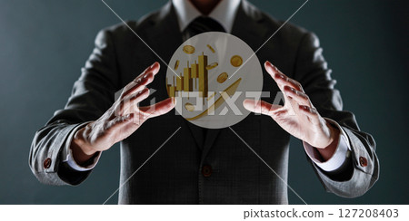 businessman with financial symbols coming from hand, stock markets concept. businessman with financial symbols coming from hand, stock markets concept. 127208403