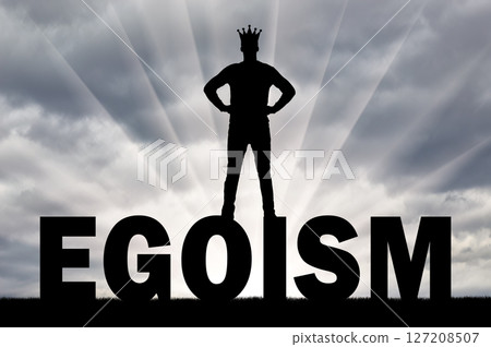 Silhouette of a man with a crown on his head is on the word ego 127208507