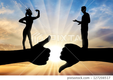 Selfishness and ego. An arrogant selfish woman with a crown on her head, considers herself better than a man. 127208517