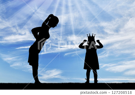 Selfishness. Dissatisfied parent Mom and selfish child girl with a crown screaming and being naughty Selfishness. Dissatisfied parent Mom and selfish child girl with a crown screaming and being naughty 127208518