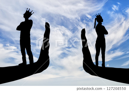 Selfishness and arrogance. Arrogant people, a woman and a man with a crown stand turned away on their hands - stop 127208550