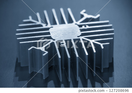 The circular shape aluminum heat sink profile in the light blue scene. The circular shape aluminum heat sink profile in the light blue scene. 127208696