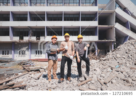 Demolition control supervisor and contractor discussing on demolish building. 127210695