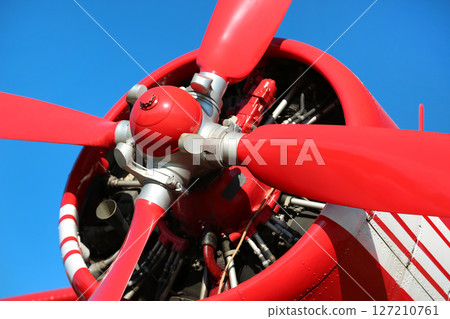 Red propeller-driven aircraft 127210761