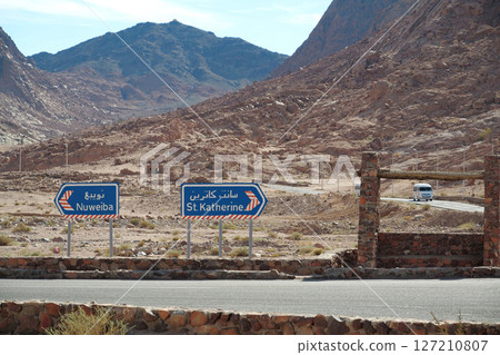 Road traffic near ancient buildings near Saint Catherines Monastery, Sinai,Egypt 127210807
