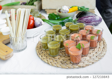 Fresh vegetables and verrines on a catering table for a wedding or birthday Fresh vegetables and verrines on a catering table for a wedding or birthday 127210843