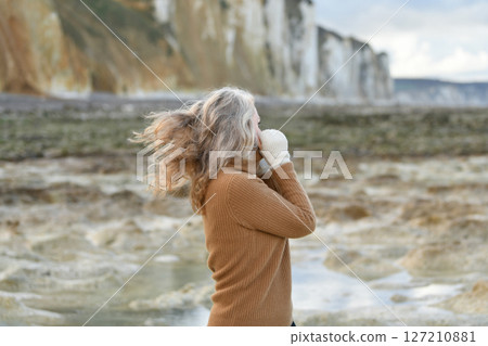 Portrait of a sixty-year-old woman with a gray hair Portrait of a sixty-year-old woman with a gray hair 127210881