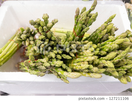 Fresh Asparagus in Foam Box at Market. 127211106