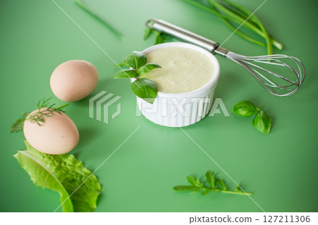 Green background and products for making fresh mayonnaise Green background and products for making fresh mayonnaise 127211306