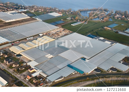 Greenhouse farming from above throug an aircraft window Greenhouse farming from above throug an aircraft window 127211688
