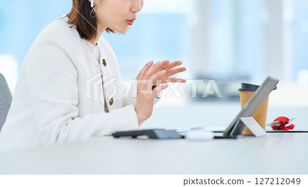 Female during an online meeting Female during an online meeting 127212049