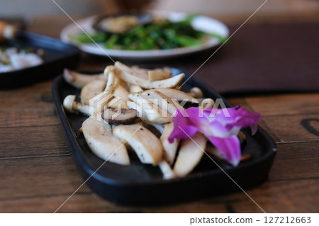 Home cook cuts oyster mushrooms into pieces Cozy kitchen with wooden table, kitchenware, vegetables, herbs and ingredients for cooking. Healthy vegan food, culinary, recipes, food blogging Home cook cuts oyster mushrooms into pieces Cozy kitchen with wooden table, kitchenware, vegetables, herbs and ingredients for cooking. Healthy vegan food, culinary, recipes, food blogging 127212663