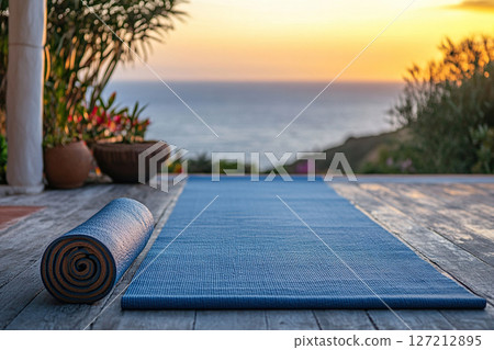 Yoga Mat at Sunset on a Deck Overlooking Ocean 127212895
