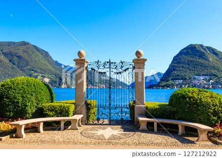 Old wrought iron gate overlooking Lake Lugano in Ciani Park, Lugano, Switzerland Old wrought iron gate overlooking Lake Lugano in Ciani Park, Lugano, Switzerland 127212922