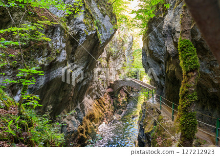 Old small stone bridge over river at Gorges de l'Areuse, Switzerland Old small stone bridge over river at Gorges de l'Areuse, Switzerland 127212923