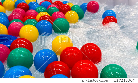 Colorful plastic balls in clear bubbly water for children playtime fun Colorful plastic balls in clear bubbly water for children playtime fun 127213364