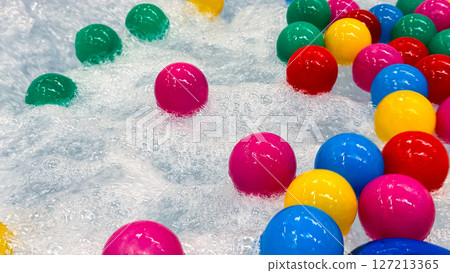 Colorful plastic balls in bubbling water Colorful plastic balls in bubbling water 127213365