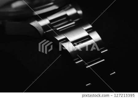 Detailed and elegant perspective of a stainless steel watch bracelet Detailed and elegant perspective of a stainless steel watch bracelet 127213395