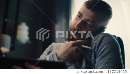 Financial Analyst, Businessman Talking on Phone, Working on Tablet Computer, Monitoring Real-Time Stocks Financial Analyst, Businessman Talking on Phone, Working on Tablet Computer, Monitoring Real-Time Stocks 127213455