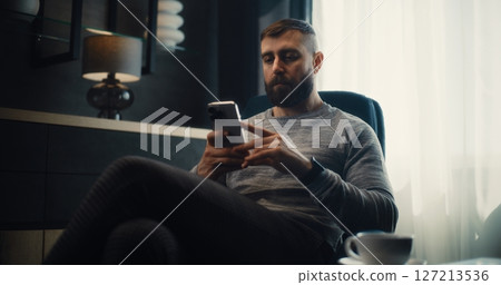 Stock Exchange Broker, Investment Agent Analyzing Real-Time Stocks Using Smartphone Stock Exchange Broker, Investment Agent Analyzing Real-Time Stocks Using Smartphone 127213536