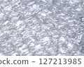 Bubble wrap macro photo with selective focus. 127213985